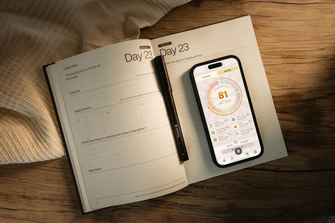 An open journal page on day 23 beside the app